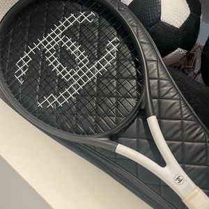 Chanel tennis racquet with Chanel leather bag